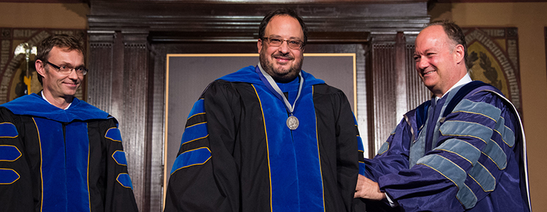 University President John J. DeGioia (right) honors Professor Derek Goldman (middle) and Professor Christian Wolf (left) with the 2015 President’s Award for Distinguished Scholar-Teachers.