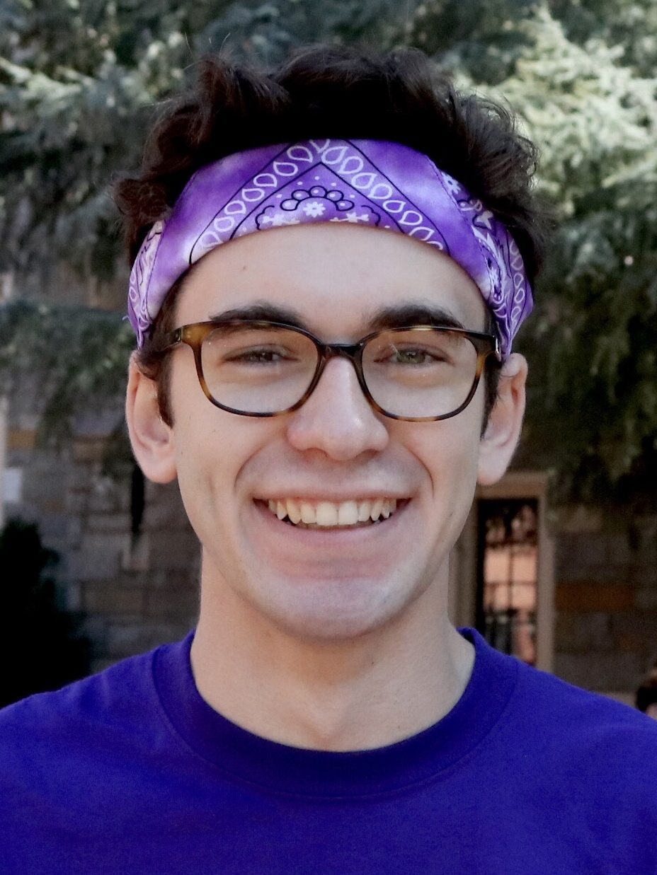 Headshot of Ben Telerski smiling wearing a purple bandana