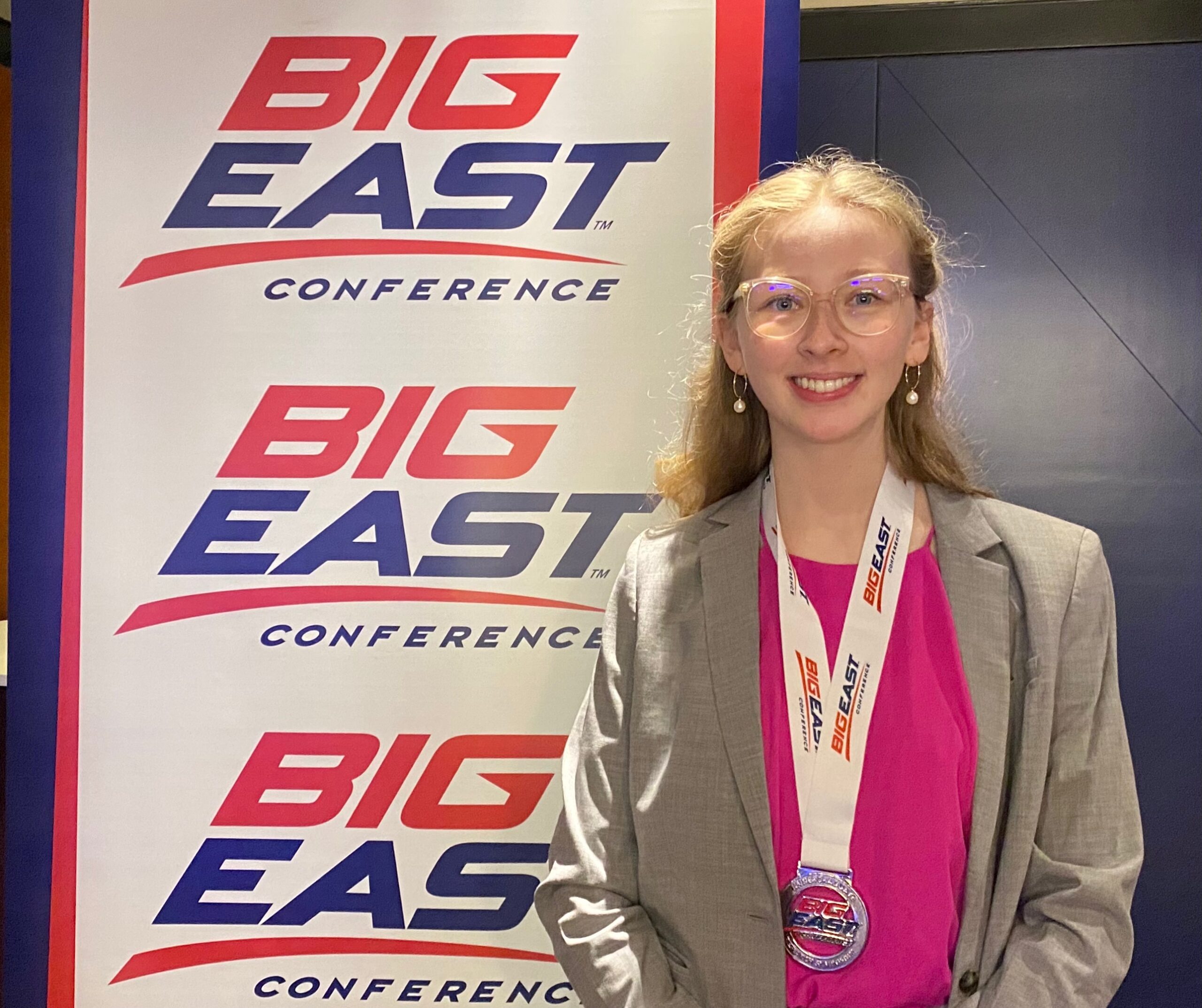 Solveign wearing medal after winning second place at the Big East Symposium