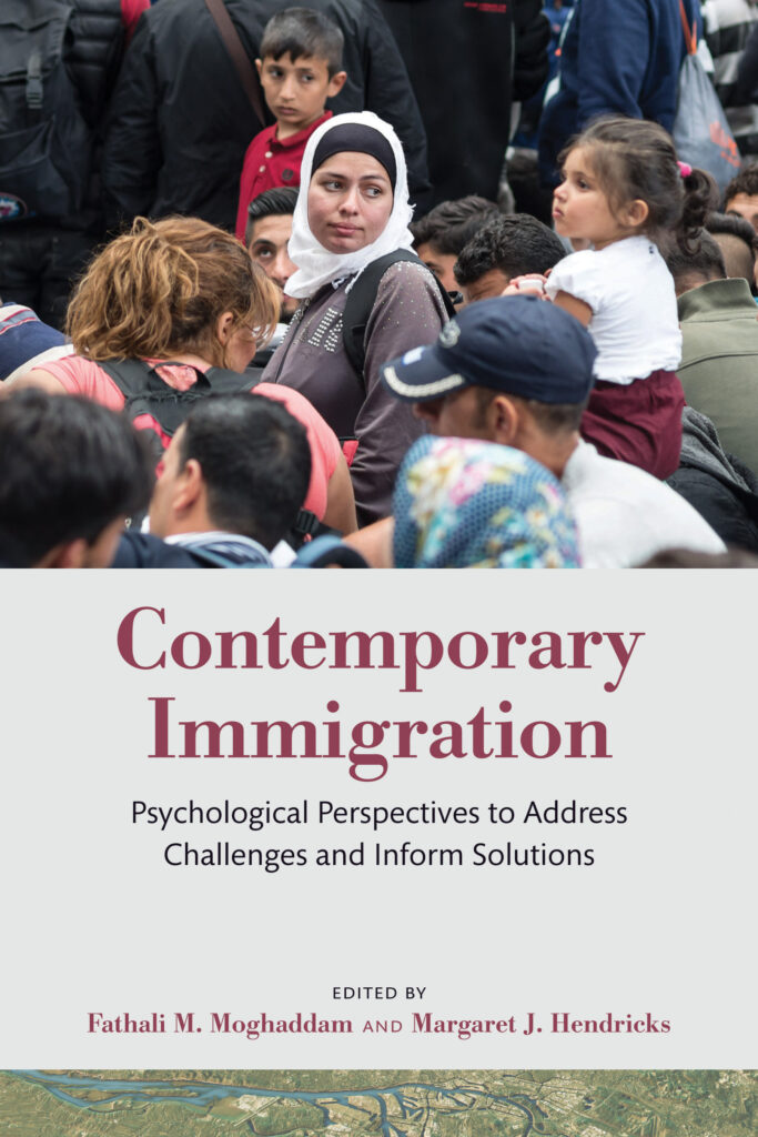 The book cover for Contemporary Immigration showing a woman with a headcovering, presumably an immigrant, moving through a crowd. 