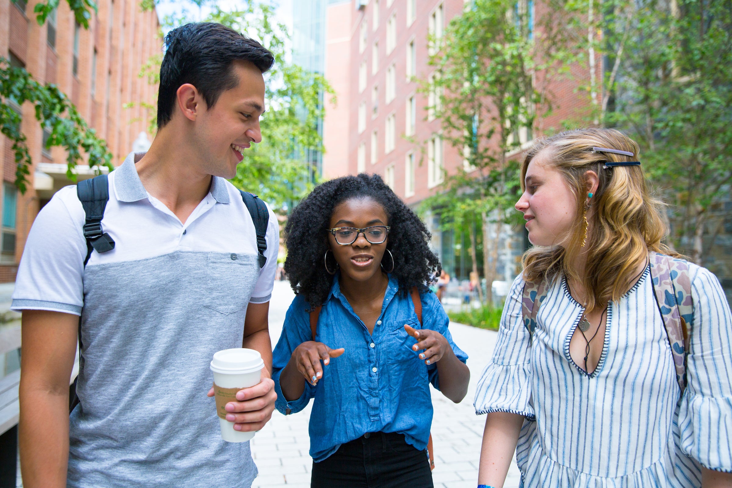 Three Undergrad students gather in main campus locations. All have been cleared and signed release forms.
