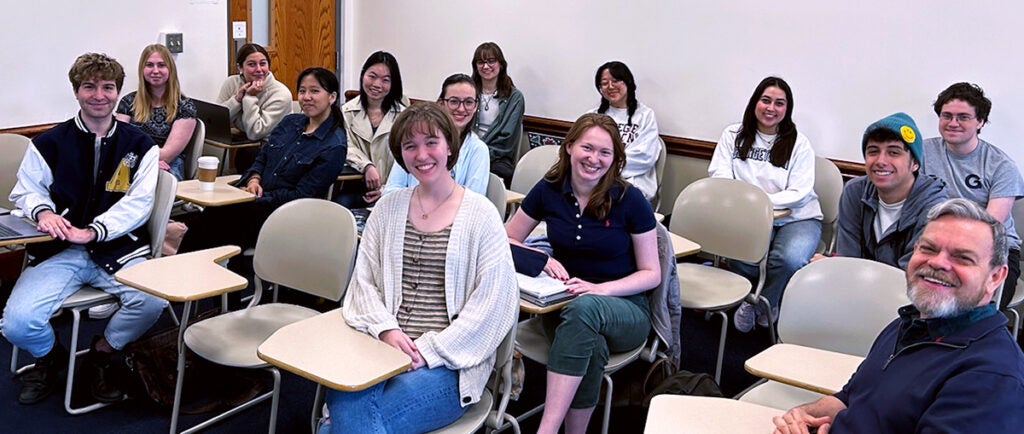 students with professor in a classroom
