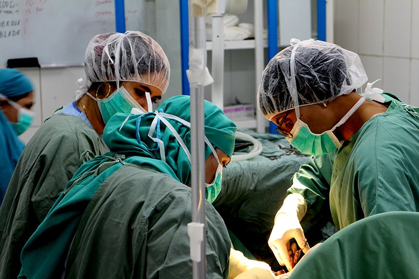 A group of doctors performing an operation.