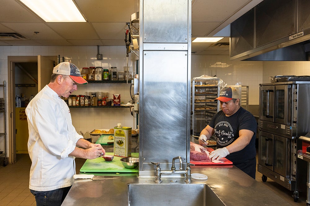 Chef Geoff and Valdemar prep ingredients