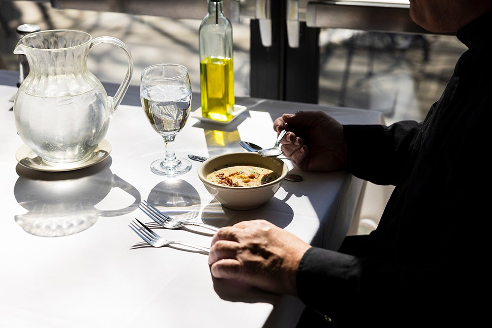 table set redy to eat, man seated at table
