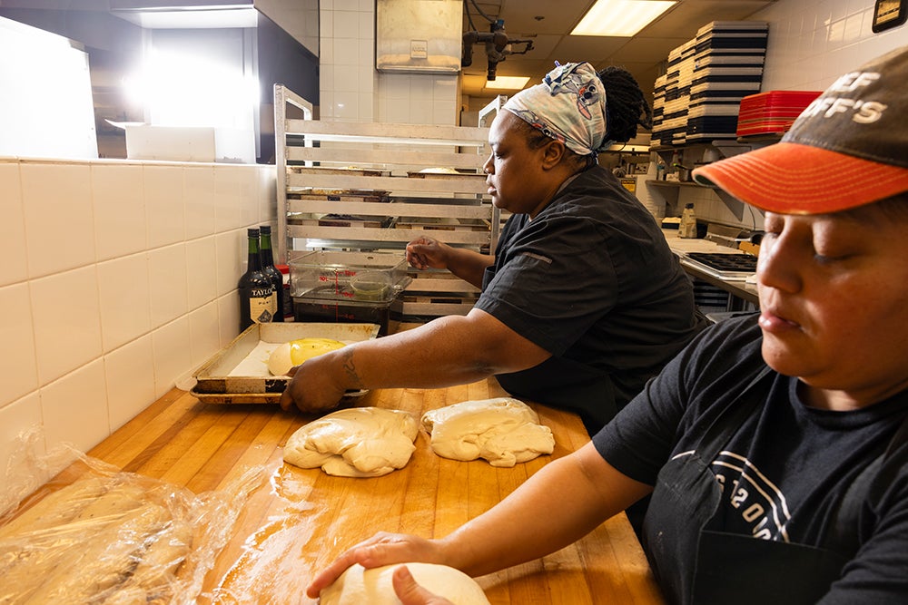Tasha and Iris knead dough for focaccia bread