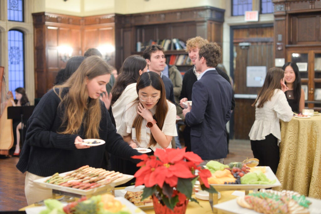 Graduating students and their friends enjoy refreshments in Copley Formal Lounge.