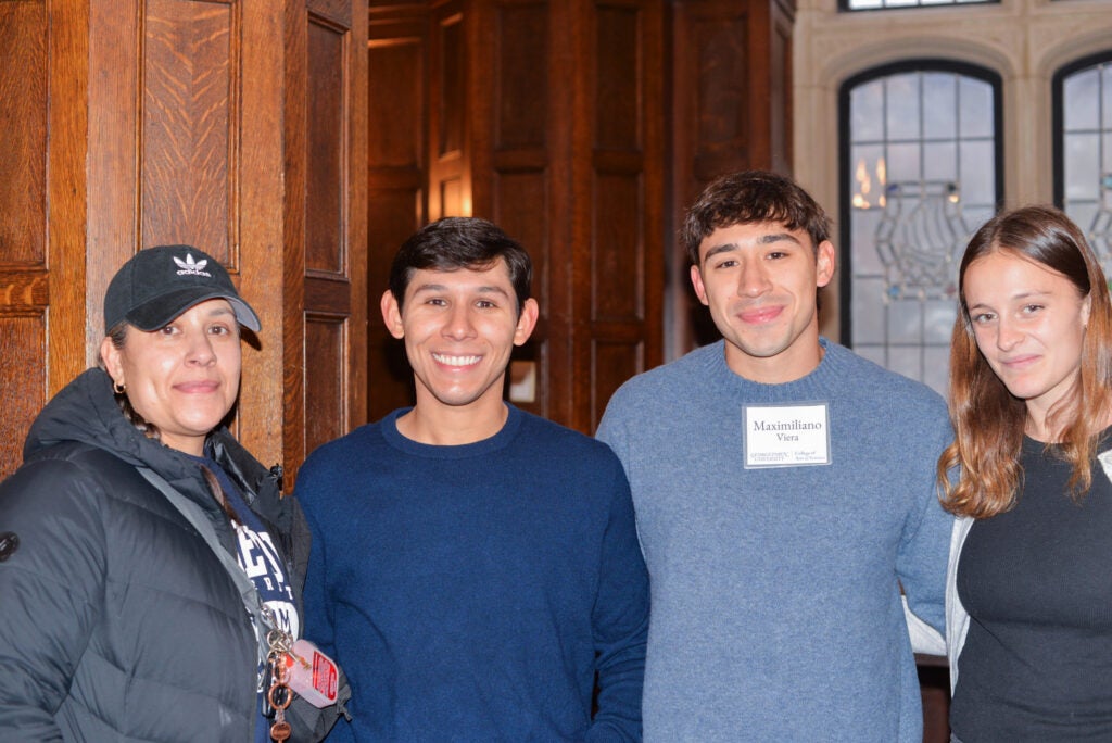 A graduating senior with his family and girlfriend.