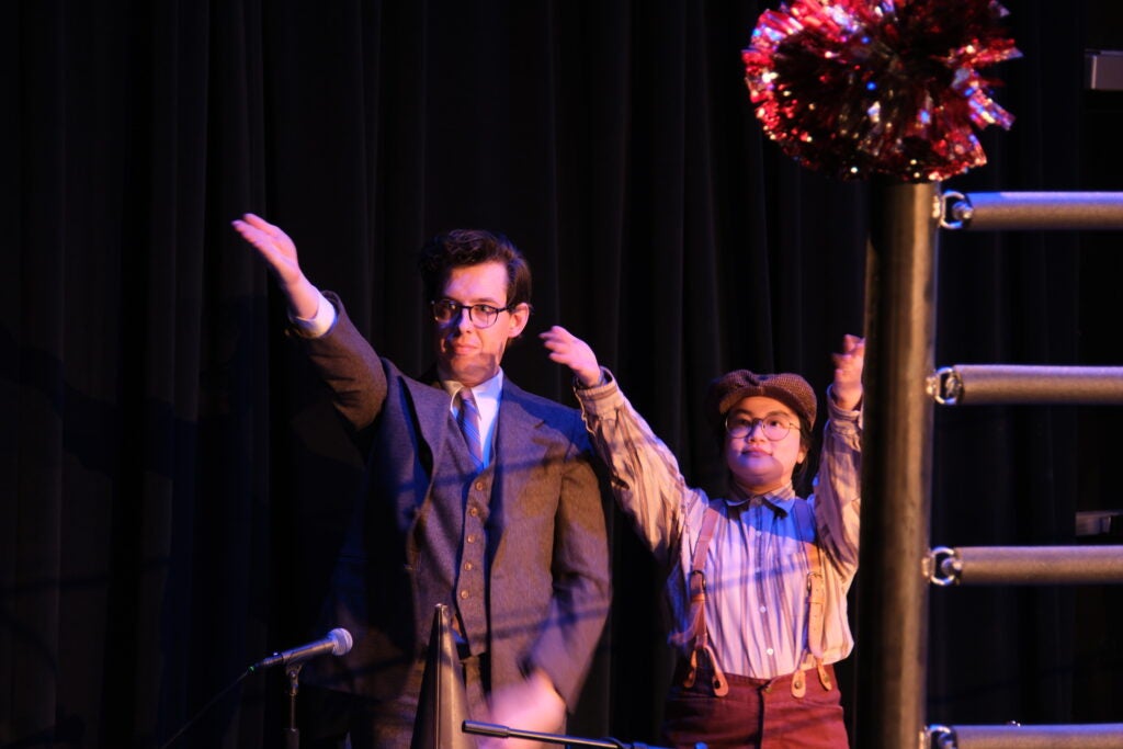 A narrator and Foley artist for a performance at the Davis Performing Arts Center