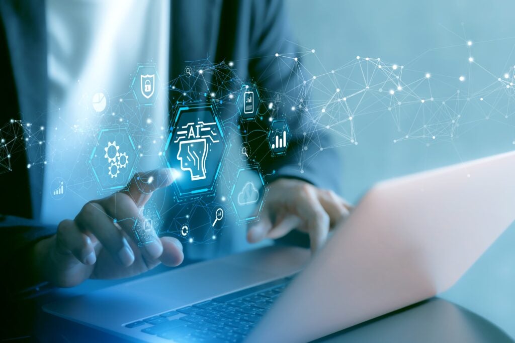 Getty Image: Person at desk with laptop