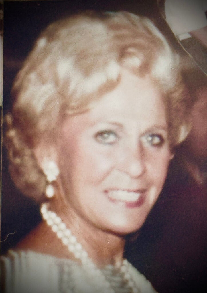 A woman wearing jewelry smiling