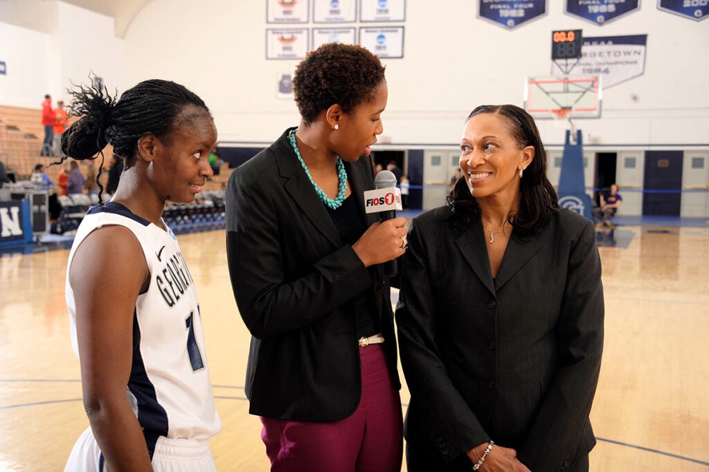 McNutt, center,  interviews Georgetown women's basketball coach Terri Williams, standing next to Sugar Rodgers