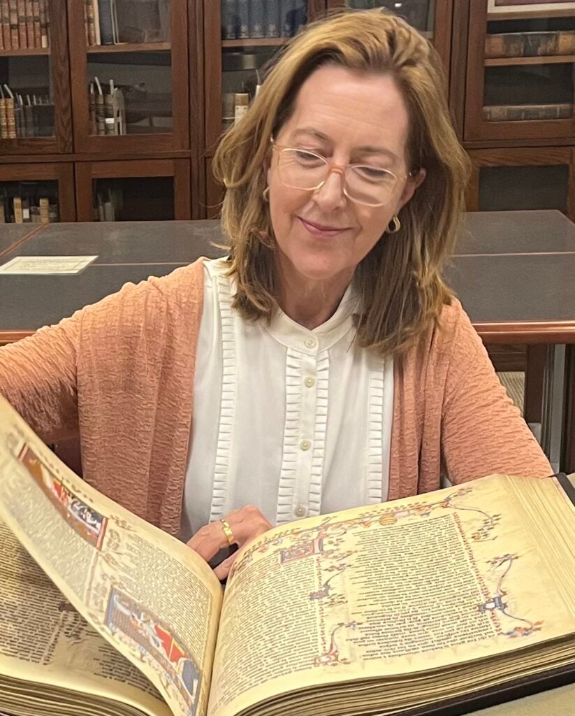 An English professor reading a manuscript