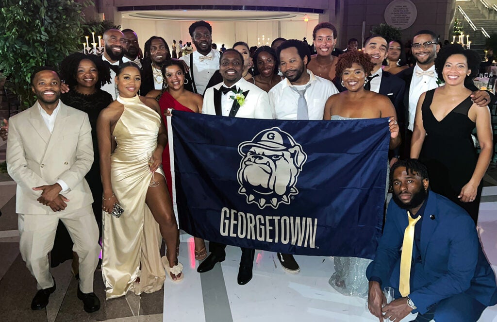 Georgetown graduates at the wedding of Henderson, center, and Cortney Robinson at the Ronald Reagan Building and International Trade Center on Aug. 10, 2024.