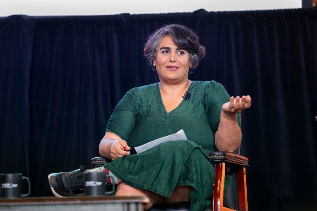 A journalist on stage at Gaston Hall