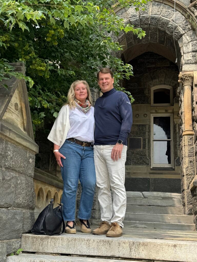 A couple posing and smiling together