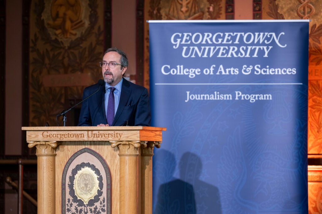 A former U.S. ambassador talks to the audience at Gaston Hall