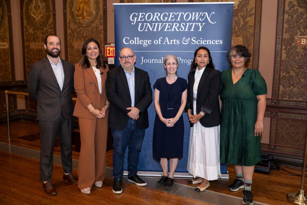 Journalists and press freedom advocates standing together at Gaston Hall