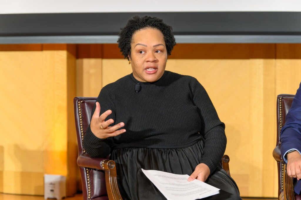 Yamiche Alcindor, a Georgetown alum, speaks to the audience at Lohrfink Auditorium
