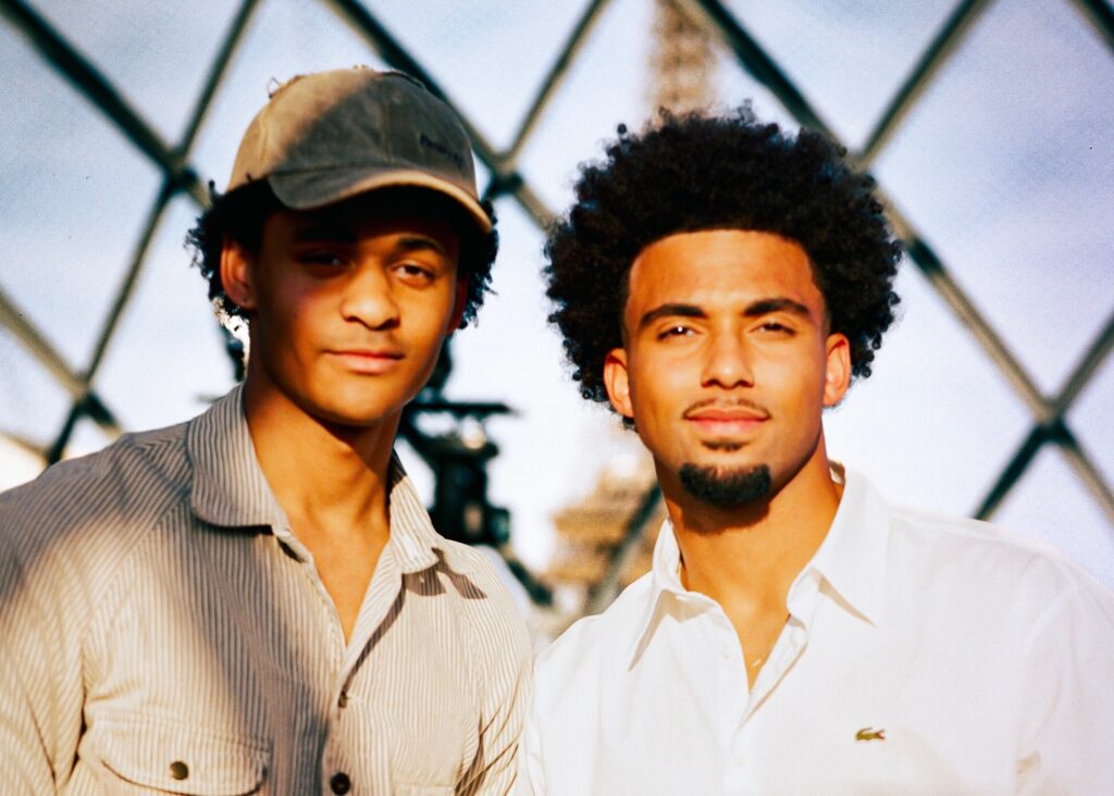 A Georgetown alum posing with a professional tennis player.