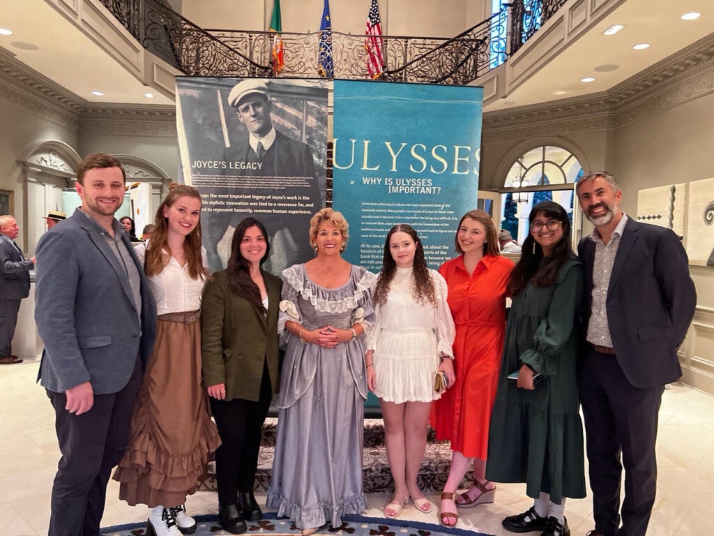 A group of students and a professor standing with the Ambassador of Ireland 