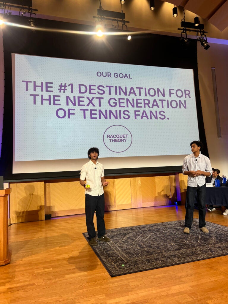 Two Georgetown students presenting at a pitch competition.