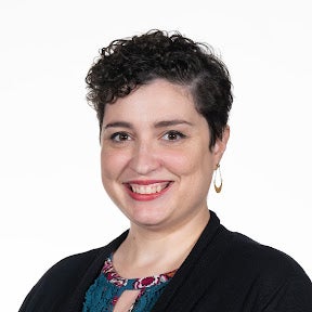 Headshot of a Georgetown University administrator posing in front of a white background.