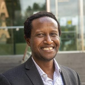 A headshot of a smiling Georgetown University professor.